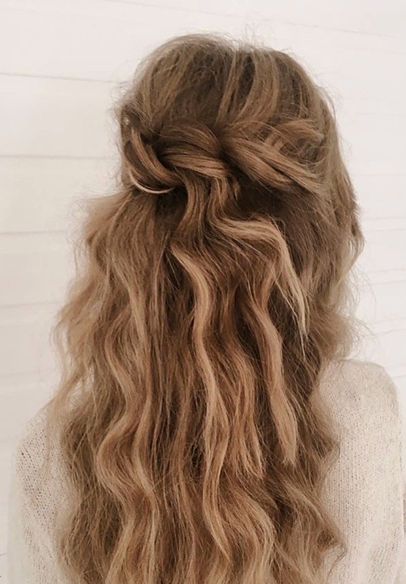 Half-up bridal style with twisted strands, seen from behind