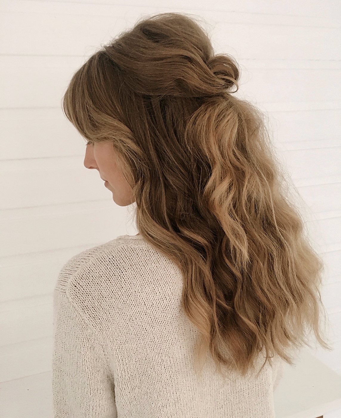 Half-up style with loose waves in side profile