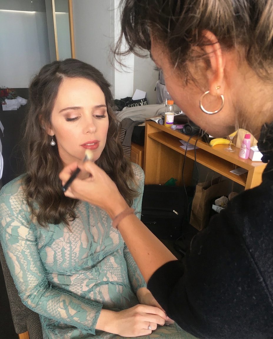 Annika applying natural make-up for a production