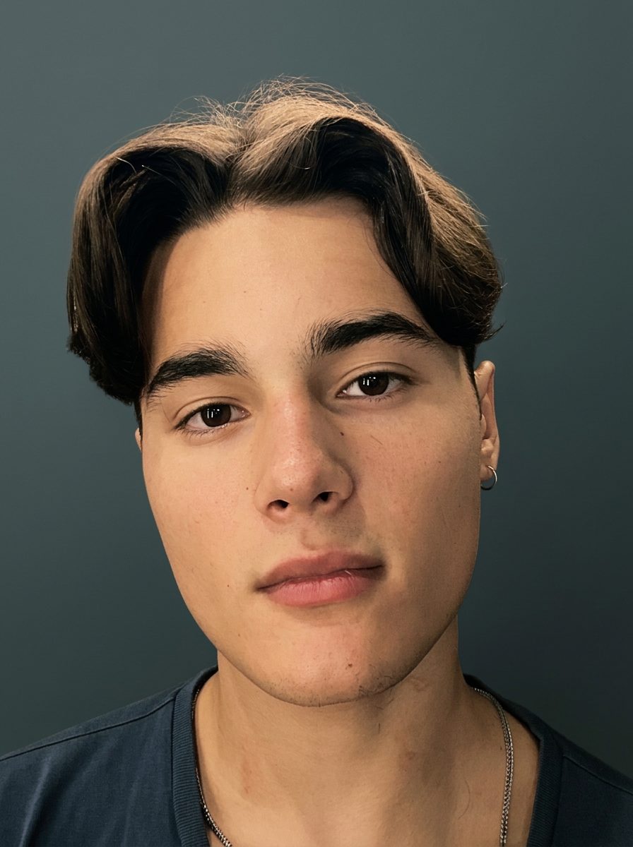 Centre-parted haircut with softly falling sides from the front
